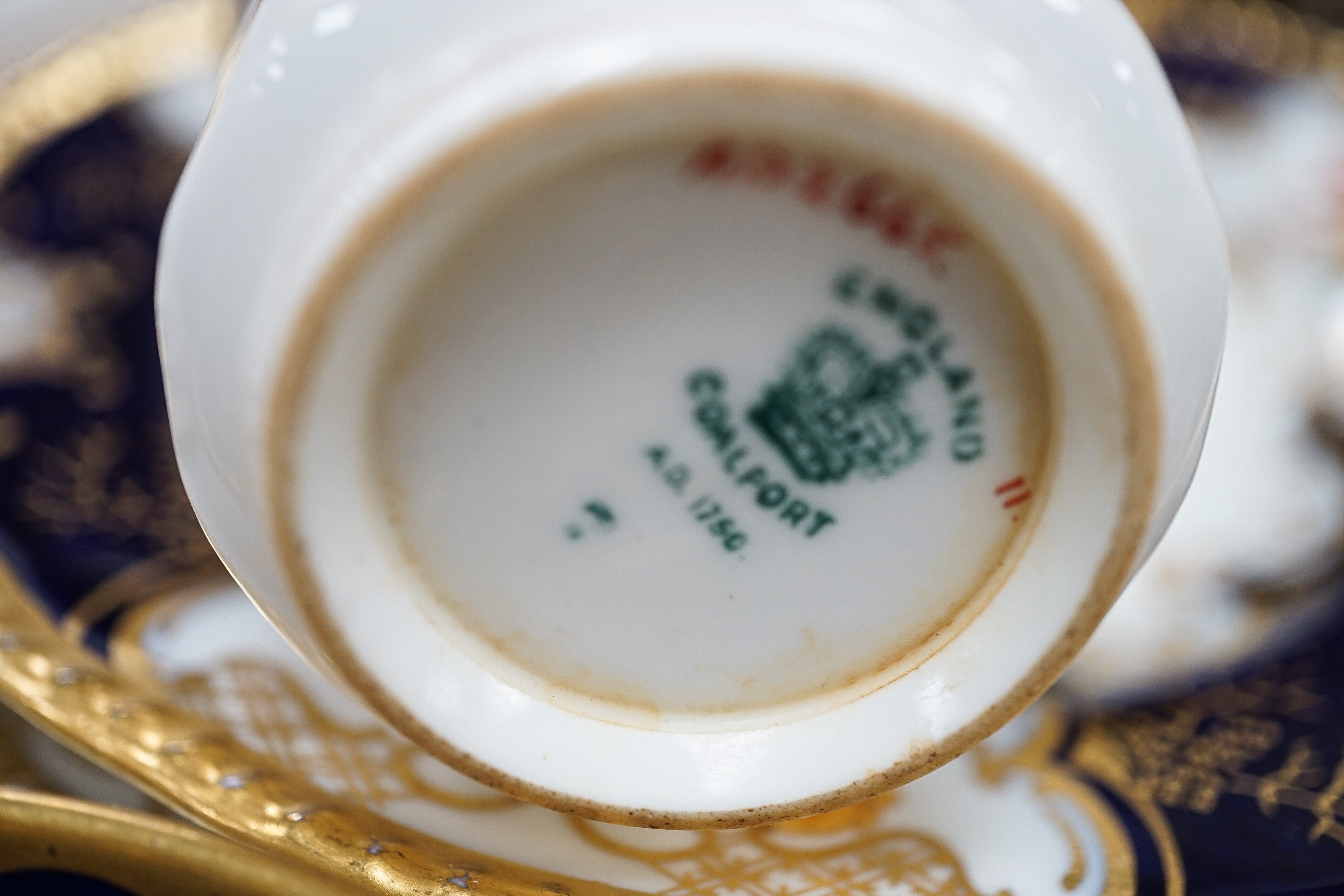 A large set of Coalport blue ground tea and coffee service and similar green ground tea wares